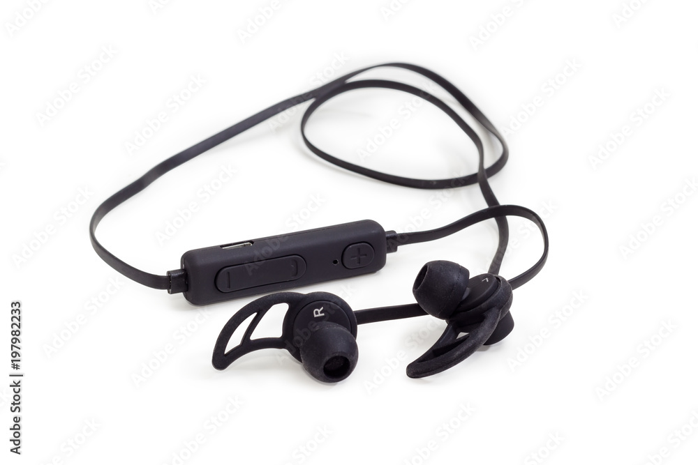 Black wireless earphones closeup on a white background Black wireless earphones closeup on a white background