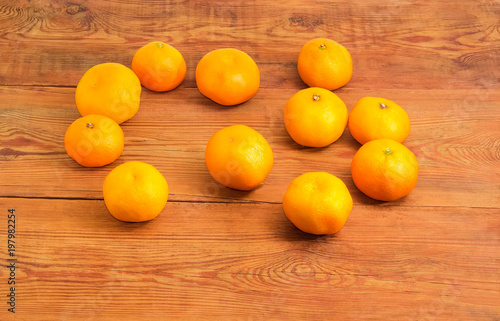 Tangerines scattered on the old rustic table
