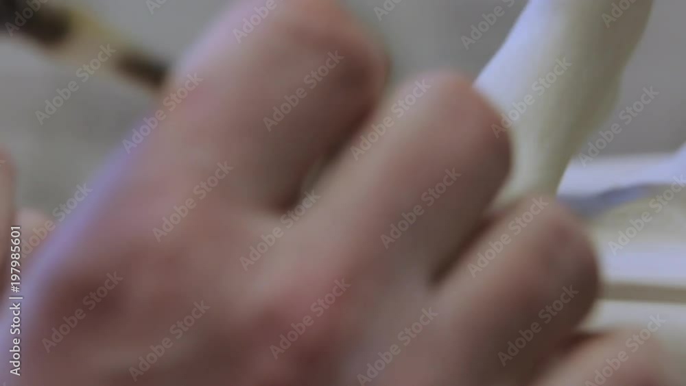 The work of the master to remove excess material on the porcelain figure. The work of the master to remove excess material on the porcelain figure.