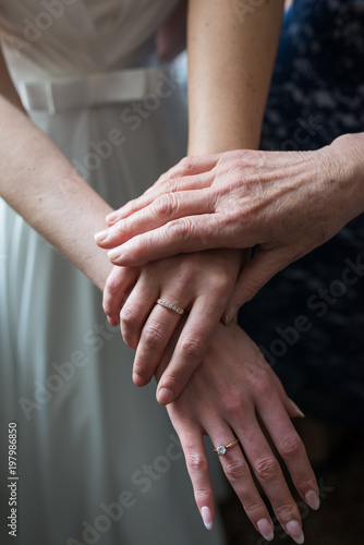Three generations. Hands daughters, moms and grandmothers. Wedding morning © Yana