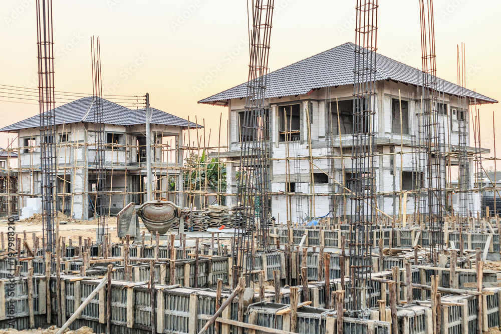 New house under construction at building site New house under construction at building site