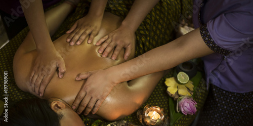 traditional asian thai four hand massage  in tropical spa photo