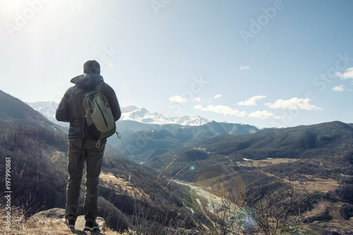 Hiker takes photo of beautiful mountains