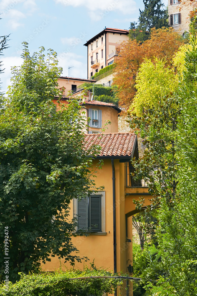 Bergamo, Italy. View of a tall ancient building with large windows.