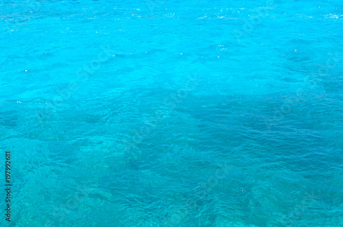 Close up of sea waves in Blue Lagoon on Comino Island, Malta. Turquoise water texture.