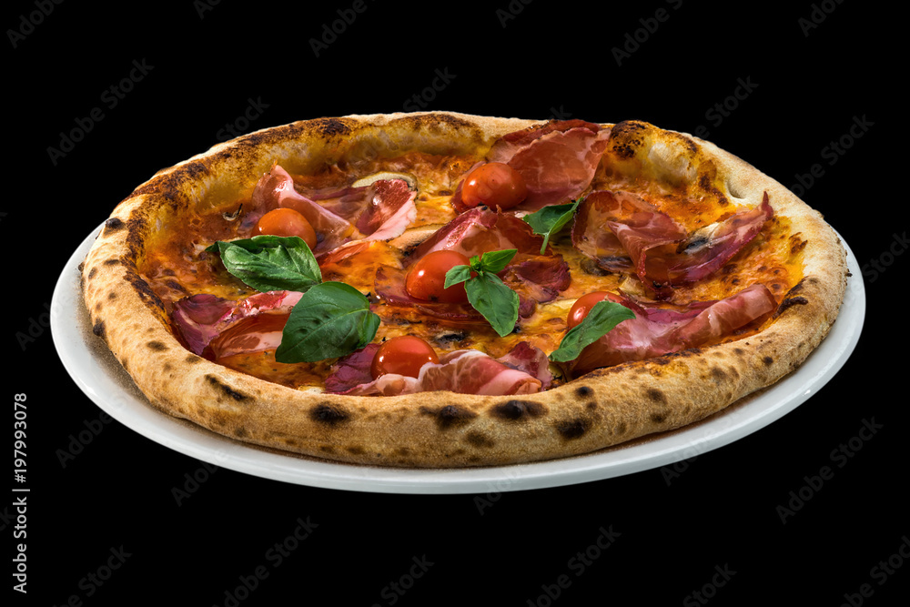 pizza with cherry tomatoes, prosciutto and basil isolated on black background