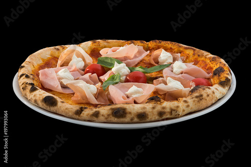 pizza with cherry tomatoes, cheese, Ham and rucola isolated on black background