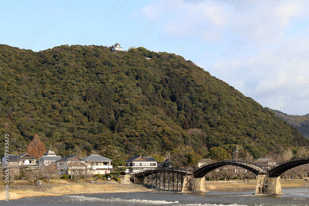 On the way to the iconic Kintai Bridge made of wood. On top of the hill is the Iwakuni Castle On the way to the iconic Kintai Bridge made of wood. On top of the hill is the Iwakuni Castle
