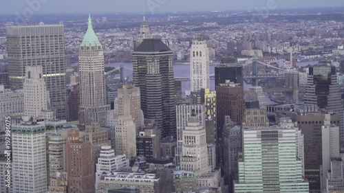 New York City telephoto aerial view of Lower Manhattan Financial District office buildings with the Brooklyn and Manhattan Bridges in the background.