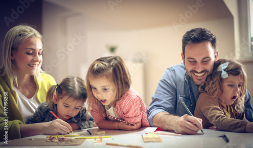 Family playing and drawing.