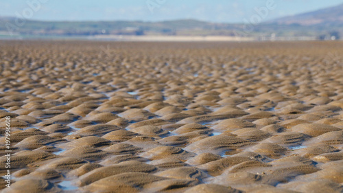 Perspective view of sand on a beach © UniquePhotoArts