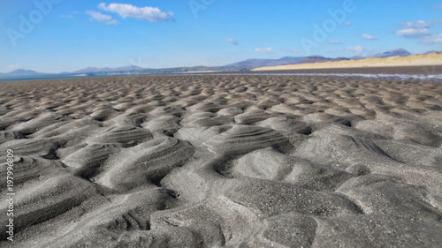 Perspective view of sand across a beach