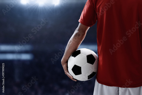 Soccer player holding soccer ball © fotokitas