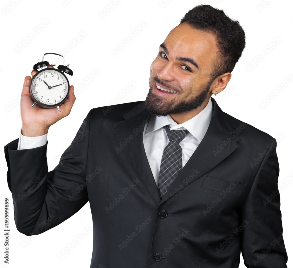 Young businessman holding alarm clock isolated on white Young businessman holding alarm clock isolated on white
