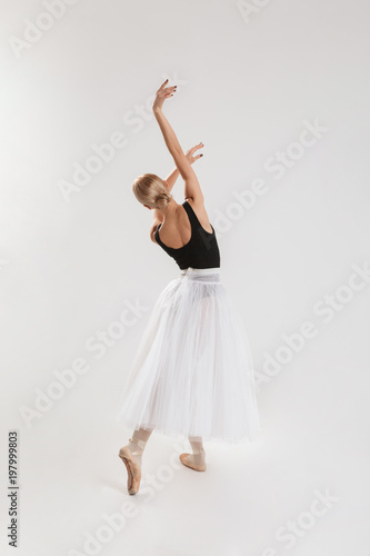 Full-lenght portrait of talented young woman ballerina