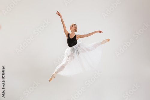 Beautiful young woman ballerina dancing