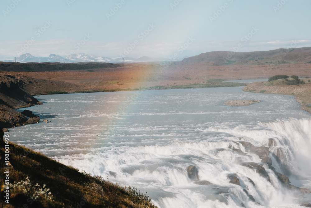 beautiful scenic icelandic landscape with river, Gullfoss waterfall and rainbow