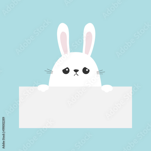 White sad bunny rabbit hanging on empty paper board template. Funny head face. Big ears. Cute cartoon character. Kawaii animal. Happy Easter. Baby card. Pet collection. Flat design. Blue background