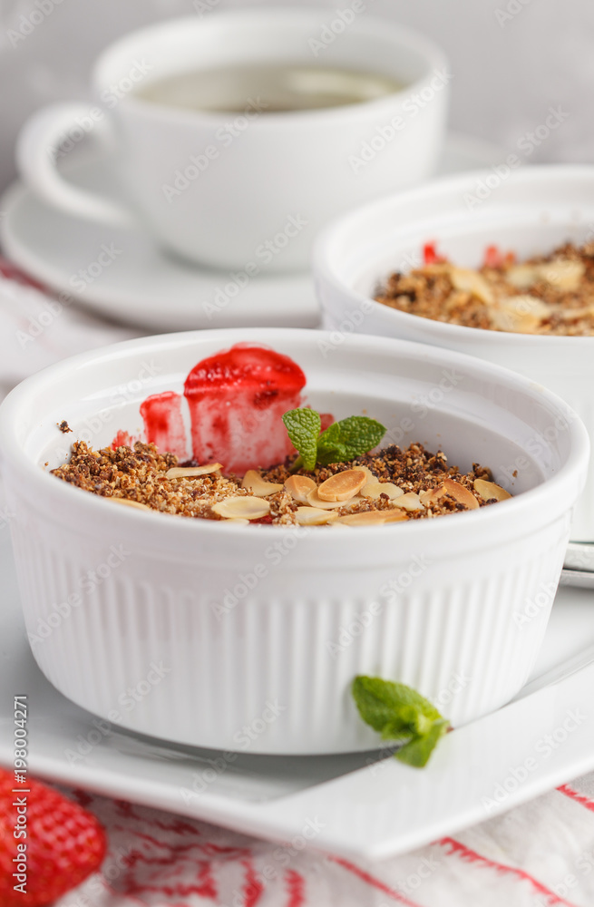 Homemade summer breakfast strawberry crumble. Mini berry cake with strawberry, light background. Healthy vegan food concept. Homemade summer breakfast strawberry crumble. Mini berry cake with strawberry, light background. Healthy vegan food concept.