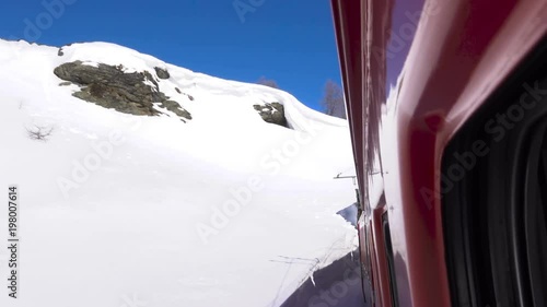Red train on Bernina Pass in Winter season