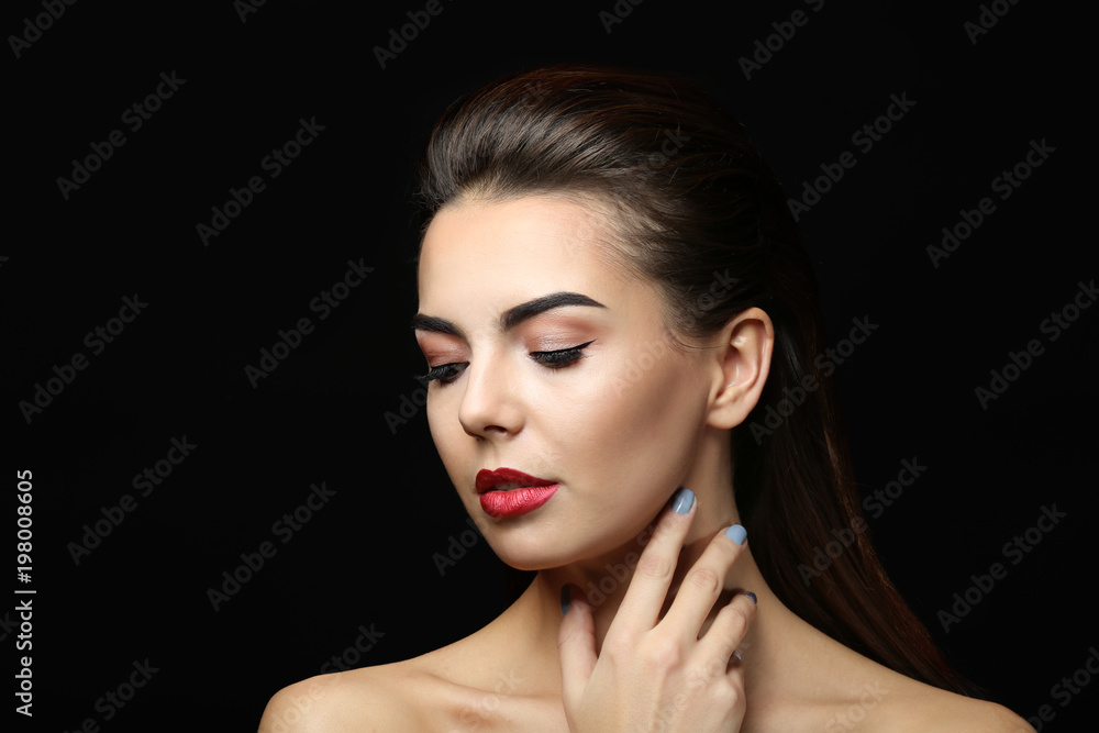 Young woman with beautiful eyebrows on black background Young woman with beautiful eyebrows on black background