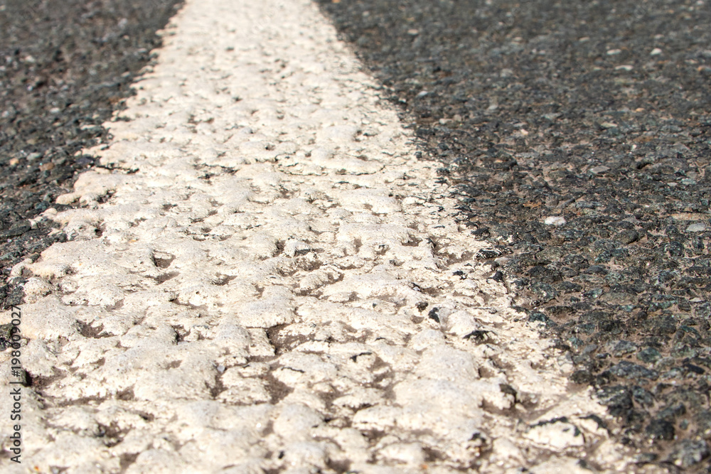 asphalt with white line close-up asphalt with white line close-up