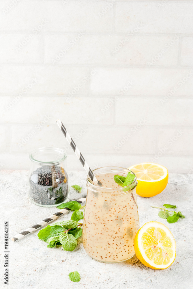 Natural energy drink, Chia fresca, infused water or lemonade on grey stone table copy space Natural energy drink, Chia fresca, infused water or lemonade on grey stone table copy space