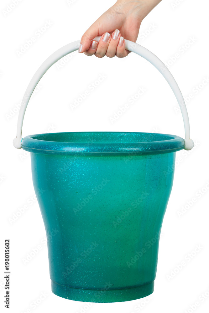 woman's hand holding a bucket on an isolated white background woman's hand holding a bucket on an isolated white background