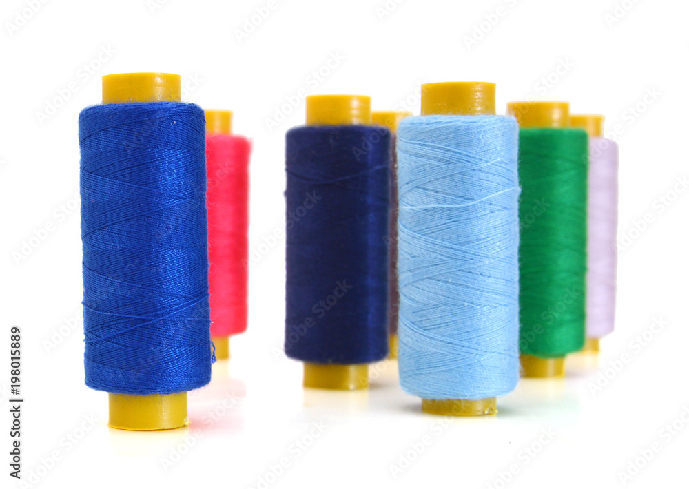 Spool of coloured thread isolated on white background. Spool of coloured thread isolated on white background.