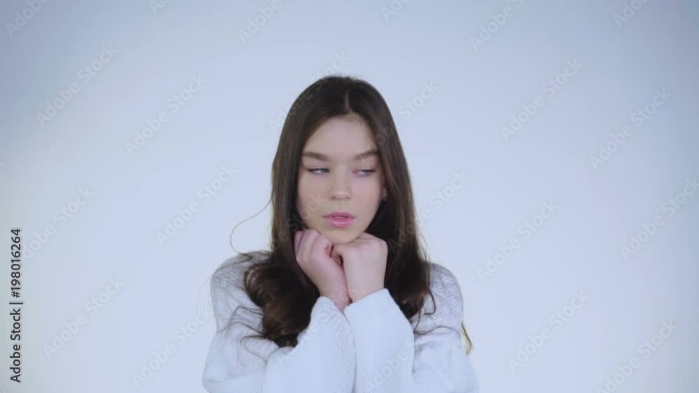 Portrait of desperate young beautiful girl leans on hands and thinking Portrait of desperate young beautiful girl leans on hands and thinking