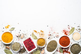Various spices in a bowls on white.