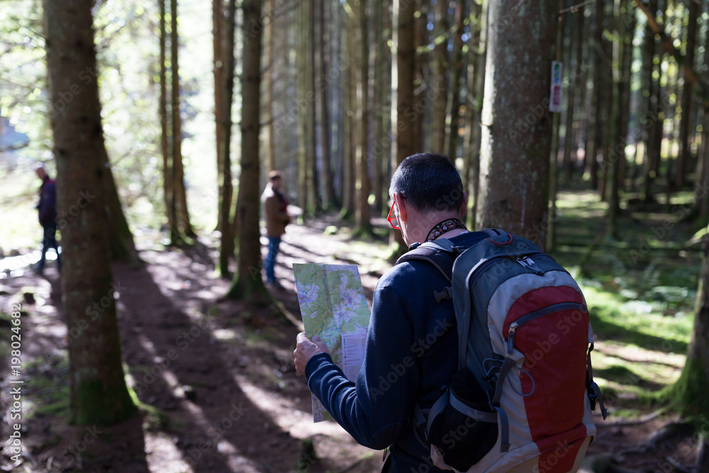 Older map finding his way in the woods Older map finding his way in the woods