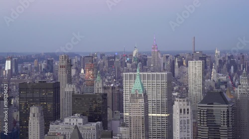 Wallpaper Mural New York City low flying telephoto aerial view of Lower Manhattan Financial District office buildings with Midtown's skyline in the background at dusk. Torontodigital.ca