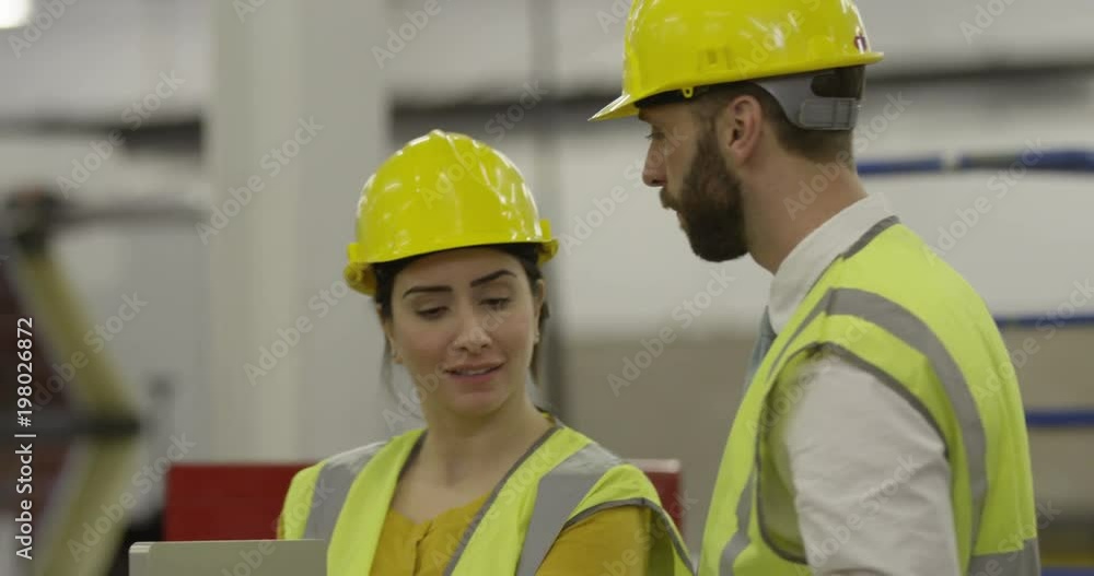 Manager and factory worker. In slow motion Manager and factory worker. In slow motion