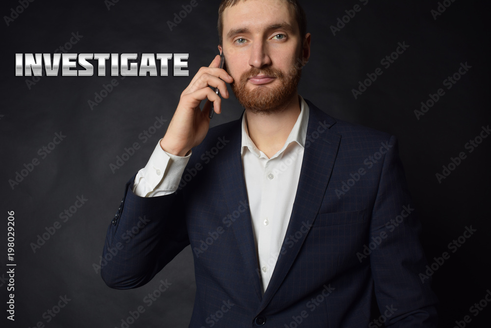 A businessman shows an inscription:INVESTIGATE A businessman shows an inscription:INVESTIGATE