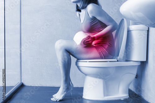 woman feel pain with constipation photo