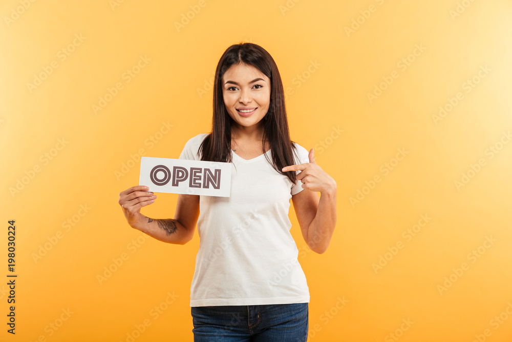 Portrait of a pretty young asian girl showing sign Portrait of a pretty young asian girl showing sign