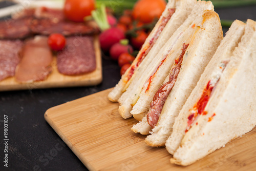 Close up on fresh club sandwiches on wooden boards