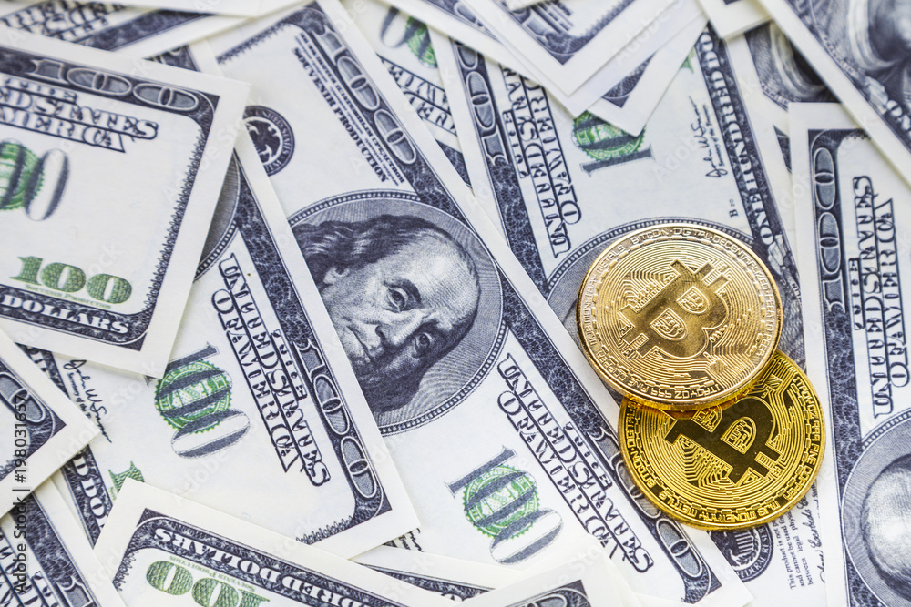 Fototapeta premium Bitcoins on dollars.