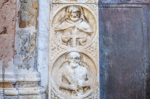 Religious stone carving on walls in Sicily, Italy