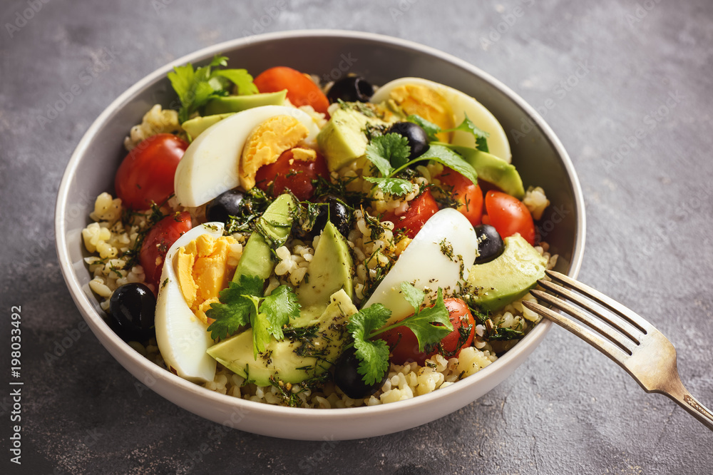 Bulgur salad with eggs, avocado, tomatoes and olives. Bulgur salad with eggs, avocado, tomatoes and olives.