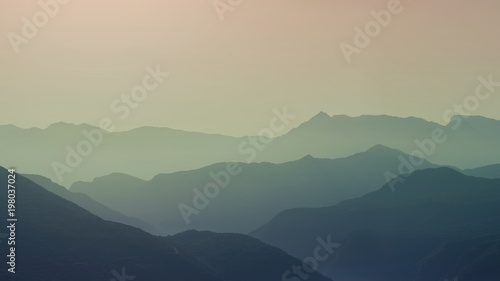 Landscape silhouette of the mountains at sunset. Panorama of peaks mountain in the Greece © flowertiare