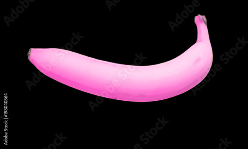 
pink banana on a black background photo