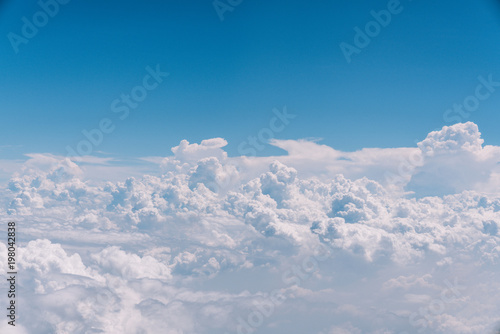 blue sky with white clouds background © peeratouchvat