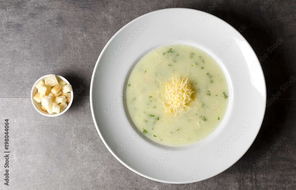 Cheese chicken soup with croutons in a white plate Cheese chicken soup with croutons in a white plate