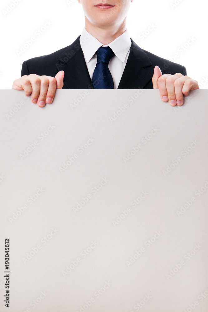 Businessman holding a banner in hands with copy space Businessman holding a banner in hands with copy space