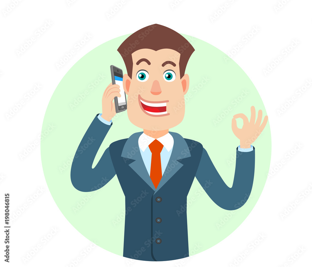 Businessman talking on mobile phone and showing a okay hand sign