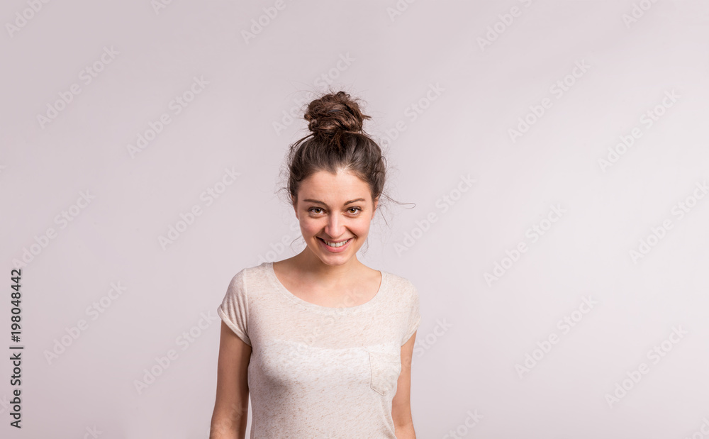 Portrait of a young beautiful woman in studio. Portrait of a young beautiful woman in studio.