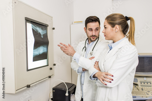 Doctors examining an x-ray ...