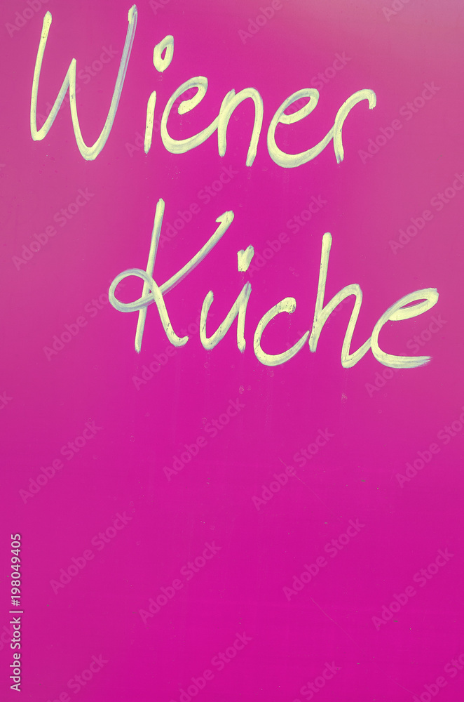 Vienna kitchen lettering against blue background